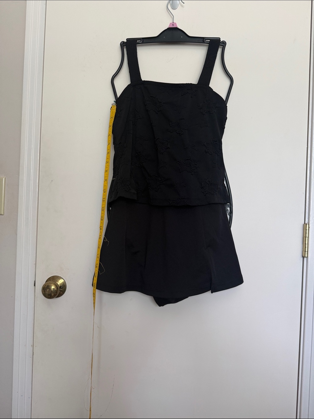 Black Sleeveless bathing suit, one piece with Textured Overlay.